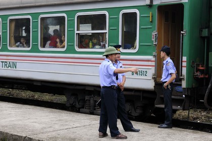Vietnam, day train from Lao Cai to Hanoi, Yen Bai station, ticket inspector