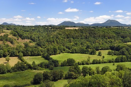 France, Puy de Dome, on the basalt mound of Saint Pierre Le Chastel overlooking the Sioule valley, the Chaine des Puys listed as World heritage by UNESCO, with the Puy de Côme on the left, the Grand Suchet and the Puy de Dôme volcano on the right