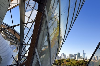 France, Paris, Louis Vuitton Foundation by architect Frank Gehry and La Defense in the background