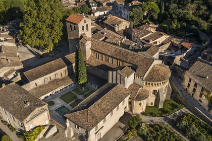 France, Herault, the Causses and the Cevennes, Mediterranean agro pastoral cultural landscape, listed as World Heritage by UNESCO, Saint Guilhem le Desert, labelled Les Plus Beaux Villages de France (The Most Beautiful Villages of France), the 9th century Gellone abbey (aerial view)