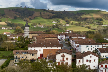 France, Pyrenees Atlantiques, Basque Country, Ainhoa, labelled Les Plus Beaux Villages de France (The Most Beautiful Villages of France), main street and Our Lady of the Assumption church (aerial view)