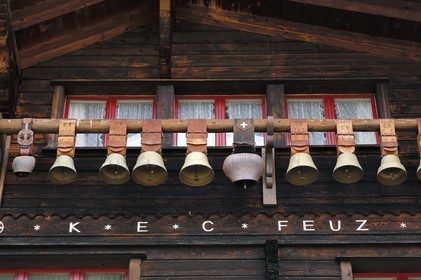 Switzerland, Canton of Bern, Bernese Oberland, Murren village, cowbells hanging on a chalet balcony
