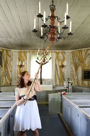 Sweden, Vasterbotten County, Umea, Gammlia Open-Air Museum and Vasterbotten museum, the Helena Elisabeth Church originally a fishermen's chapel on the island of Holmö from 1803, candle lighting