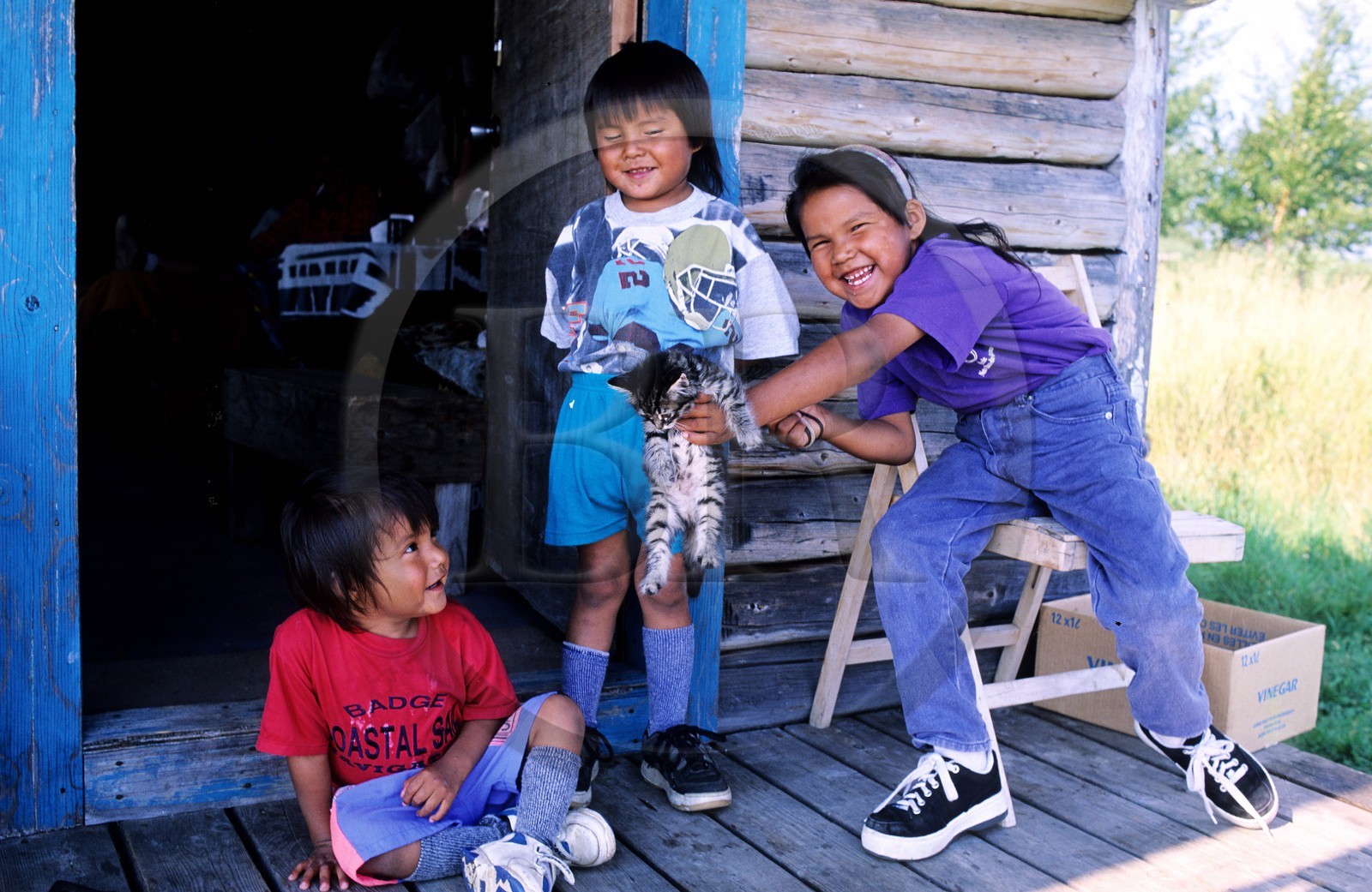 Canada, Quebec Province, La Verendrye Wildlife Reserve, Lake Victoria, village of Lake Victoria, Algonquian's children in front of their house