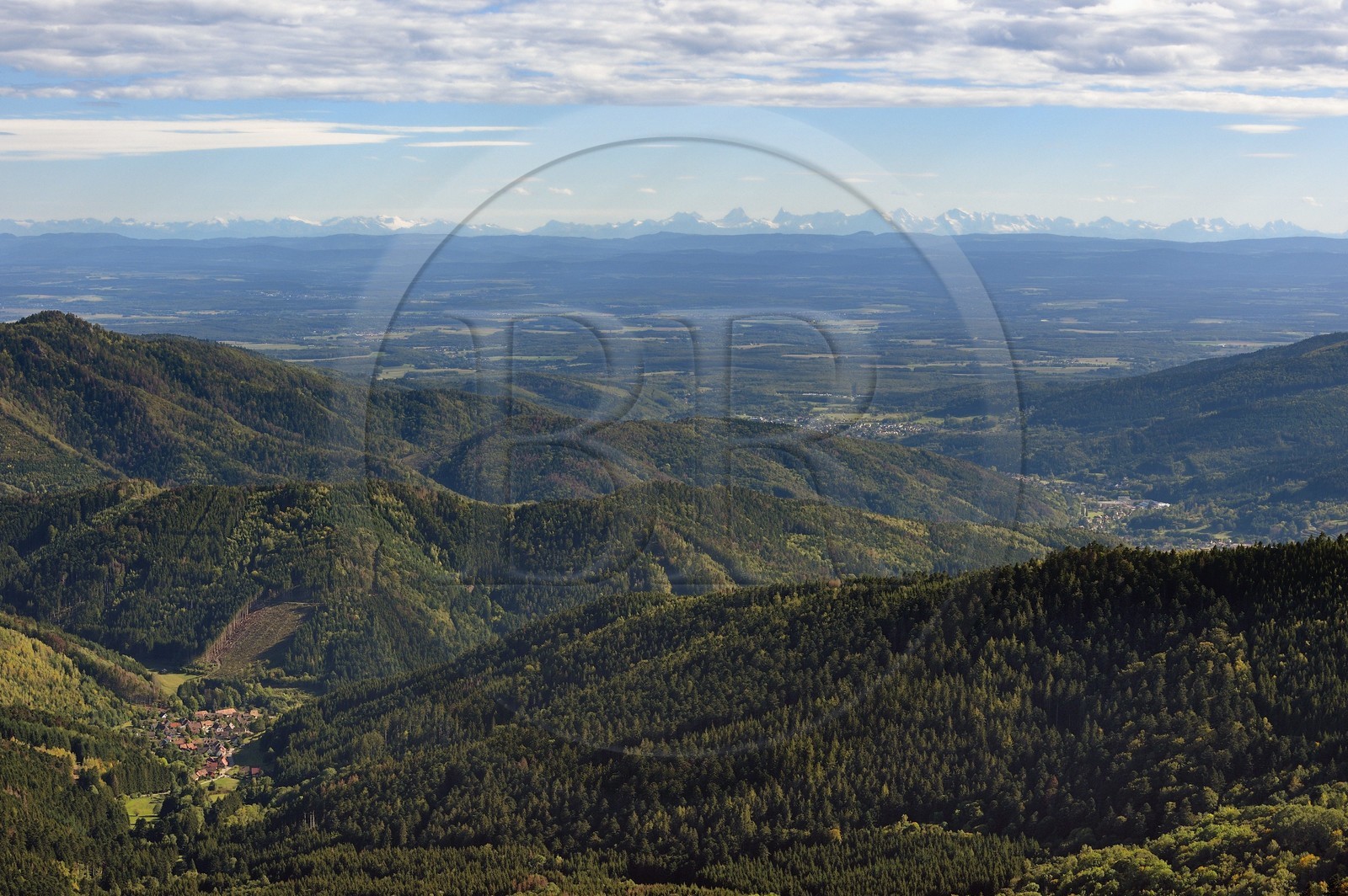 France, Vosges, Ballons des Vosges Regional Natural Park, Saint Maurice sur Moselle, view from the Tete des Perches mountain peak, the village of Rimbach pres Masevaux, the plain of Alsace and the Alps in the background