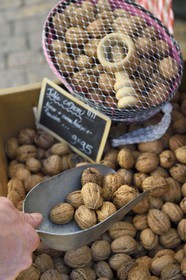France, Dordogne, Perigord Noir, Dordogne valley, Sarlat la Caneda, market day on Place de la Liberté (Liberty square), nuts stall