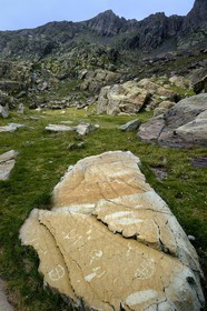 France, Alpes-Maritimes, parc national du Mercantour (Mercantour National Park), the Vallee des Merveilles (Valley of Wonders) scattered with thousands of rupestral engravings of the Bronze Age and the Pas de l'Arpette (Arpette pass) in the background