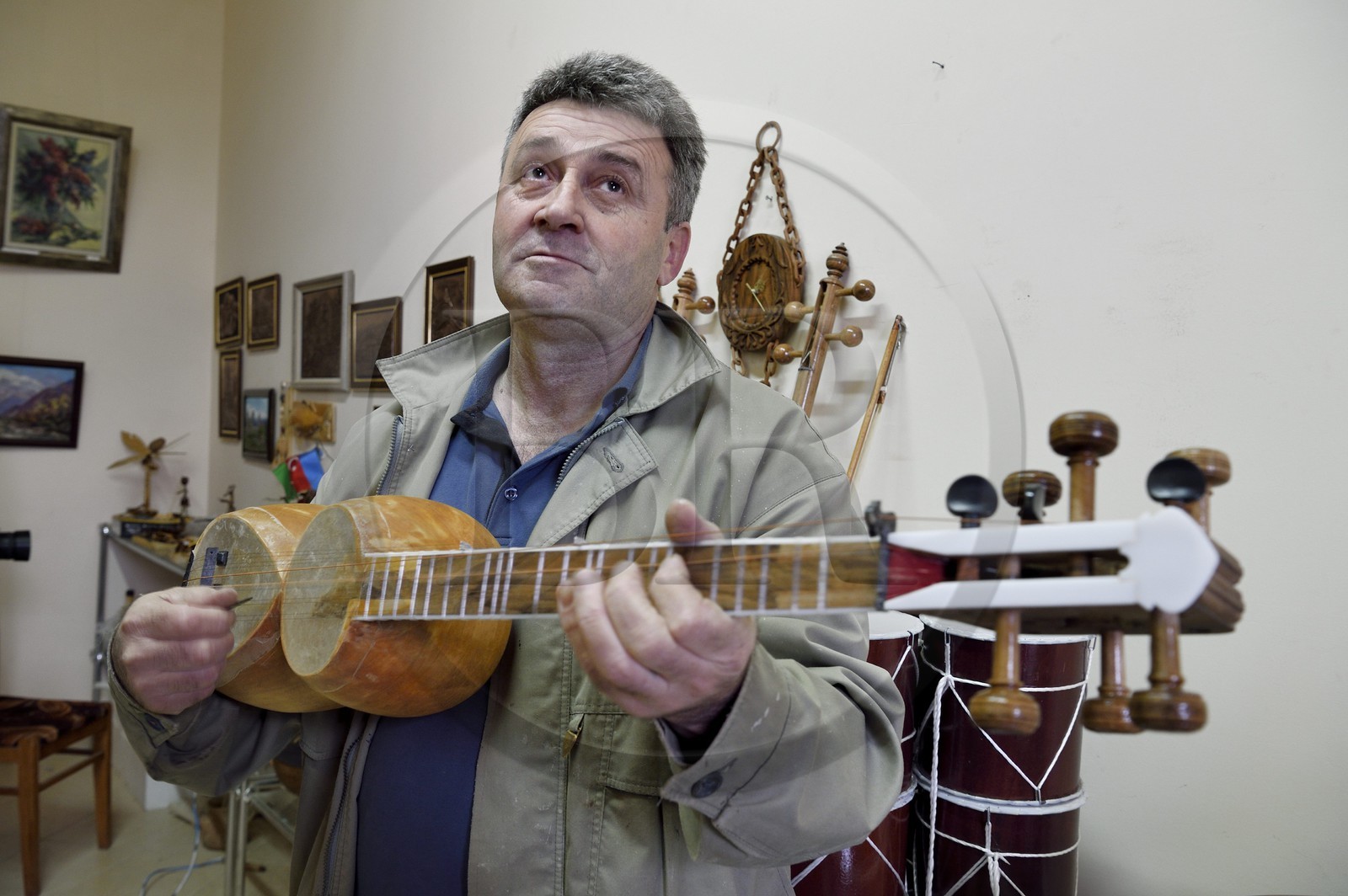 Azerbaijan, Shaki, traditional string instrument maker, the luthier Mahir Valadov reparing a tar (lute)