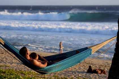 France, Reunion island (French overseas department), Petite-Ile on the southern coast, Grande Anse beach, hammock stretched between two palm trees