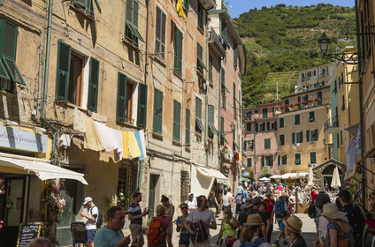Italy, Liguria, Cinque Terre National Park listed as World Heritage by UNESCO, village of Vernazza, rush hour in the main street