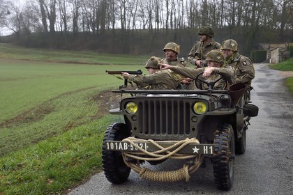 France, Eure, Sainte Colombe prés Vernon, Allied Reconstitution Group (US World War 2 and french Maquis historical reconstruction Association), reenactors in uniform of the 101st US Airborne Division progressing in a jeep Willys