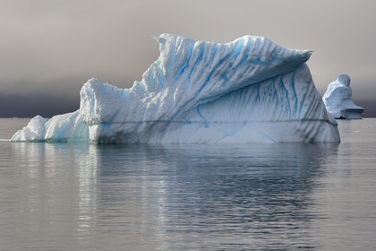 Greenland, west coast, Disko Island, Qeqertarsuaq village bay, icebergs in the mist