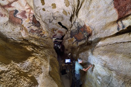 France, Dordogne, Montignac, Montignac-Lascaux Parietal Art international Centre (Lascaux 4) building site, the axial diverticulum of the reconstituted cave by the Atelier des Fac-Similés du Périgord (Perigord's Facsimile Workshop AFSP), finishing of the lower part murals by the painter Gilles Lafleur