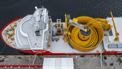 Norway, Ostfold County, Halden, Nexans Aurora cable-laying vessel, vessel for laying electric cables, connecting and repairing these cables, in the center the turntable which has the capacity to carry up to 10,000 tonnes of cables (aerial view)