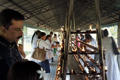 Sri Lanka, center province, Kandy, Temple of the Buddha Tooth (Sri Dalada Maligawa), place where the pilgrims are burning incense and oil in offering to Buddha