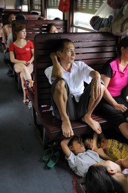 Vietnam, day train from Lao Cai to Hanoi, class Sat hard without climatisation, people sleep where they can