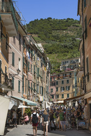 Italy, Liguria, Cinque Terre National Park listed as World Heritage by UNESCO, village of Vernazza, rush hour in the main street