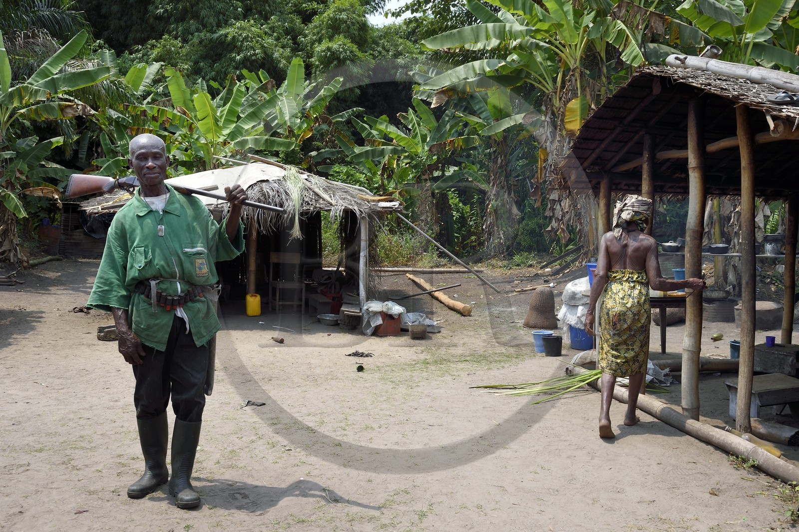 Gabon, Ogooue-Maritime Province, Omboue region, Nengeue Sika (Silver island) in the Fernan Vaz (Nkomi) lagoon, man leaving for hunting with his gun
