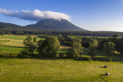 France, Puy de Dome, Parc Naturel Régional des Volcans d'Auvergne (regional nature park of Auvergne volcanoes), Chaine des Puys listed as World heritage by UNESCO, the Puy de Dôme volcano whose summit is in the clouds (aerial view)