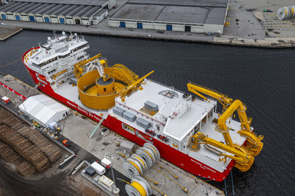Norway, Ostfold County, Halden, Nexans Aurora cable-laying vessel, vessel for laying electric cables, connecting and repairing these cables, in the center the turntable which has the capacity to carry up to 10,000 tonnes of cables (aerial view)