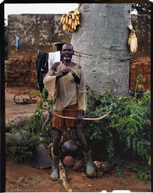 Burkina Faso, Poni province, Lobi land, Loropéni, the old Houliéné Kambou, peasant and hunter, posing with bow and arrows