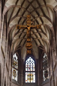 Germany, Baden-Wurttemberg, Freiburg im Breisgau, the cathedral (Munster), the late romanesque crucifix (Boecklin Kreuz, 1210) placed high over the altar in the crossing