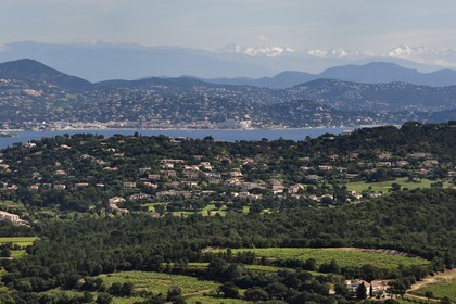 France, Var, Gulf of Saint Tropez, Gassin, labelled Les Plus Beaux Villages de France (The Most Beautiful Villages of France), the peninsula of Saint-Tropez and the city of Sainte-Maxime, snow-covered pre-Alps in the background
