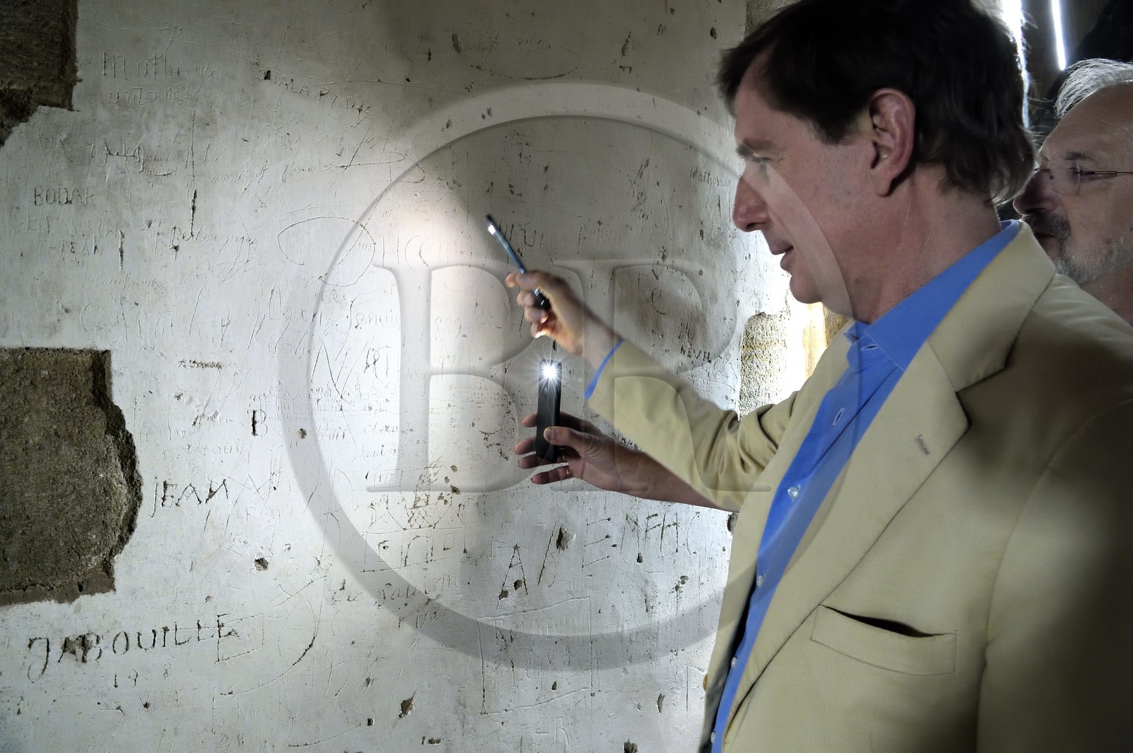 France, Allier (03), former province of Bourbonnais, Besson, Fourchaud castle (14th century to 16th century) now belonging to the descendants of the Bourbon-Parma, the Prince Charles Henri de Lobkowicz looking at graffiti on the second floor including that of Sieur Porcheron who represented the city of Angoulême and dated 1753 France, Allier (03), former province of Bourbonnais, Besson, Fourchaud castle (14th century to 16th century) now belonging to the descendants of the Bourbon-Parma, the Prince Charles Henri de Lobkowicz looking at graffiti on the second floor including that of Sieur Porcheron who represented the city of Angoulême and dated 1753