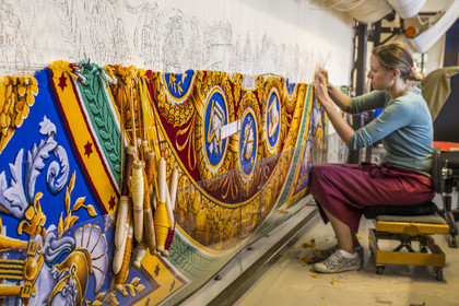France, Herault, Lodève, Manufacture de la Savonnerie (Savonnerie manufactory) unique annex of the National Carpet Factory of the Savonnerie des Gobelins in Paris, manufacture of the Cohortes carpet after a model by Jacques-Louis de la Hamayde de Saint-Ange intended for the Palace of the Legion of Honor, tapestry brooches and the weaver Morgane Pognard unravels the colors on the loom