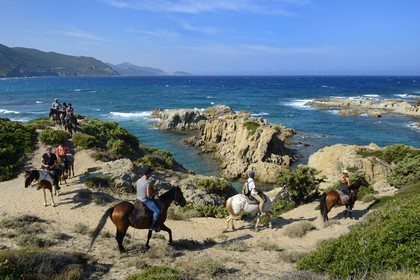 France, Haute Corse, Nebbio, Agriates Desert, Peraiola Cove, riders on the East of Ostriconi beach