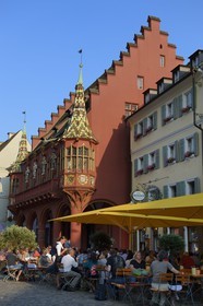 Germany, Baden-Wurttemberg, Freiburg im Breisgau, the Historical Merchants Hall of the early 16th century on the Munsterplatz and Terrace of the restaurant Oberkirch