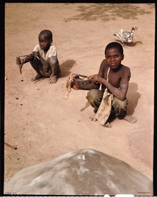 Burkina Faso, Poni province, Lobi land, Loropéni region, Ouadara, children with stone-throwers behind the tomb of their brother, the lance-thrower is often the first weapon of the young lobi until his initiation