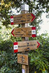 Italy, Liguria, Cinque Terre National Park listed as World Heritage by UNESCO, village of Monterosso al Mare, sign indicating the various hiking trails starting from the sanctuary of Nostra Signora de Soviore