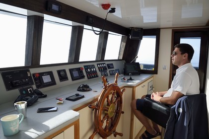 Croatia, Dalmatia, Dubrovnik, cruise ship Ave Maria and its captain Rade Naranca in the wheelhouse