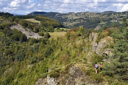 France, Haute Loire, Loire river Valley, Lafarre, hikers progressing towards the Tour de Mariac from the 11th century ruins of the Chateau de Lafarre above the gorges of La Langougniole, tributary of the Loire