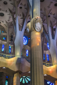 Spain, Catalonia, Barcelona, Eixample district, Sagrada Familia basilica by Catalan modernist architect Antoni Gaudi, listed as a UNESCO World Heritage Site, the east side of the Nave and the bins designed to accommodate large choirs, the columns of the central vessel (nave) are subdivided into branches like a tree