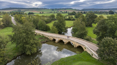 France, Yonne, Montreal (Burgundy), Hikers crossing the bridge over the Serein River (aerial view)
