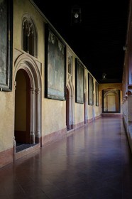 Spain, Extremadura, Guadalupe, Royal Monastery of Santa Maria de Guadalupe listed as World Heritage by UNESCO, Mudejar cloister built in the 15th century and the church in the background
