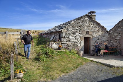 France, Cantal, Parc Naturel Régional des Volcans d'Auvergne (regional nature park of Auvergne volcanoes), Brezons valley, mountain pastures, Buron de la Combe de la Saure directed by Denis Deconquand, a mountain restaurant in Lauze stone in a former sheepfold