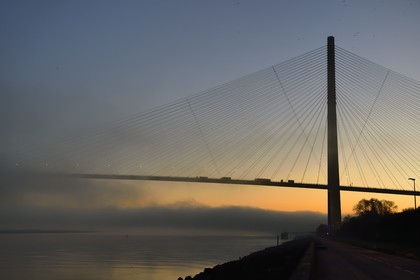 France, between  Calvados and Seine Maritime, the Pont de Normandie (Normandy Bridge) in the mists of dawn, it spans the Seine to connect the towns of Honfleur and Le Havre