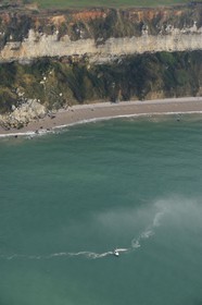 France, Seine-Maritime, sailboat along the cliffs north of Le Havre (aerial view)