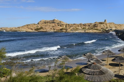 France, Haute Corse, Balagne, L'Ile Rousse, the Pietra Lighthouse and the fifteenth century Genoese tower behind the beach