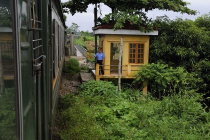 Vietnam, day train from Lao Cai to Hanoi, Vietnam Railways agent at a bridge crossing