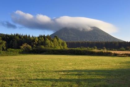France, Puy de Dome, Parc Naturel Régional des Volcans d'Auvergne (regional nature park of Auvergne volcanoes), Chaine des Puys listed as World heritage by UNESCO, the Puy de Dôme volcano whose summit is in the clouds