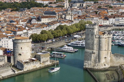 France, Charente Maritime, La Rochelle, the Old Port, Tour de la Chaine left and Tour Saint Nicolas right protect the entrance to the Old Port (aerial view)