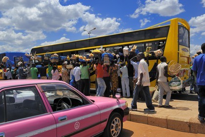 Tanzania, Morogoro, the bus terminal, small vendors assaults at a bus stop