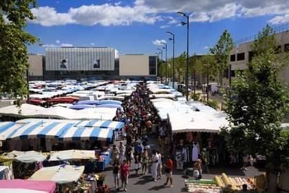 France, Herault, Beziers, the district of the Champ de Mars, the friday market on the 14th of july place and the multimedia library Andre Malraux