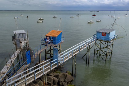 France, Loire Atlantique, Estuaire de la Loire, Saint Nazaire, Trébézy beach, fisherman Roland Dupont in his traditional carrelet (fishing shack) (aerial view)