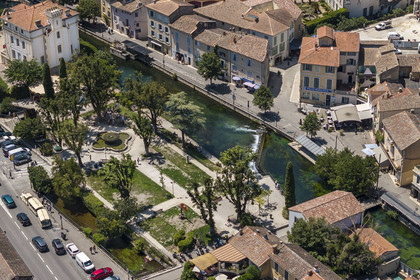 France, Vaucluse, L'Isle sur la Sorgue, the old town along the quai Jean Jaures on the Sorgue river (aerial view)