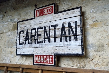 France, Manche, Carentan, L'Atelier, the wartime groceries café, reconstituted by Sylvie and Jean-Marie Caillard, collectors of 1940s military and civilian objects, wooden Carentan city sign